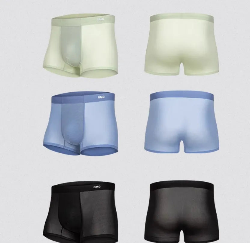 Man wearing seamless grey fitness shorts with antibacterial finish, sizes up to 3XL.