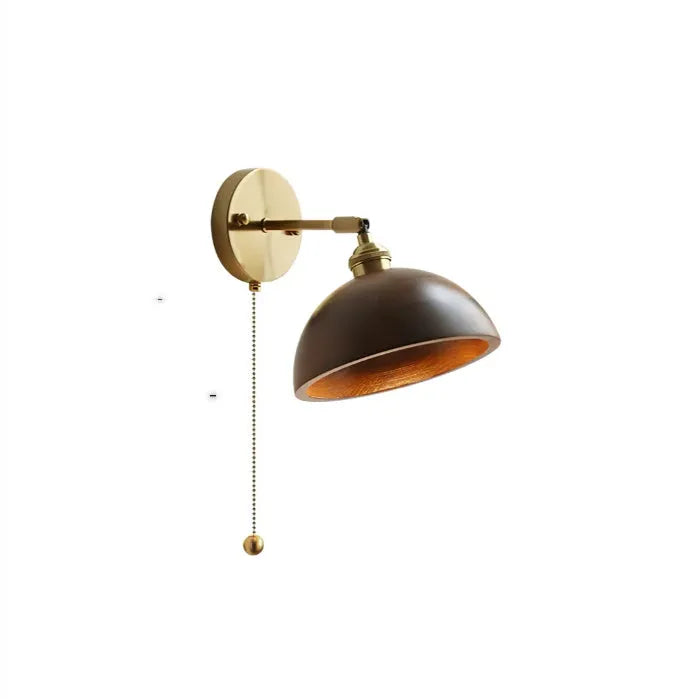 Nordic bedside wall lamp in walnut wood colour on a bedroom wall.