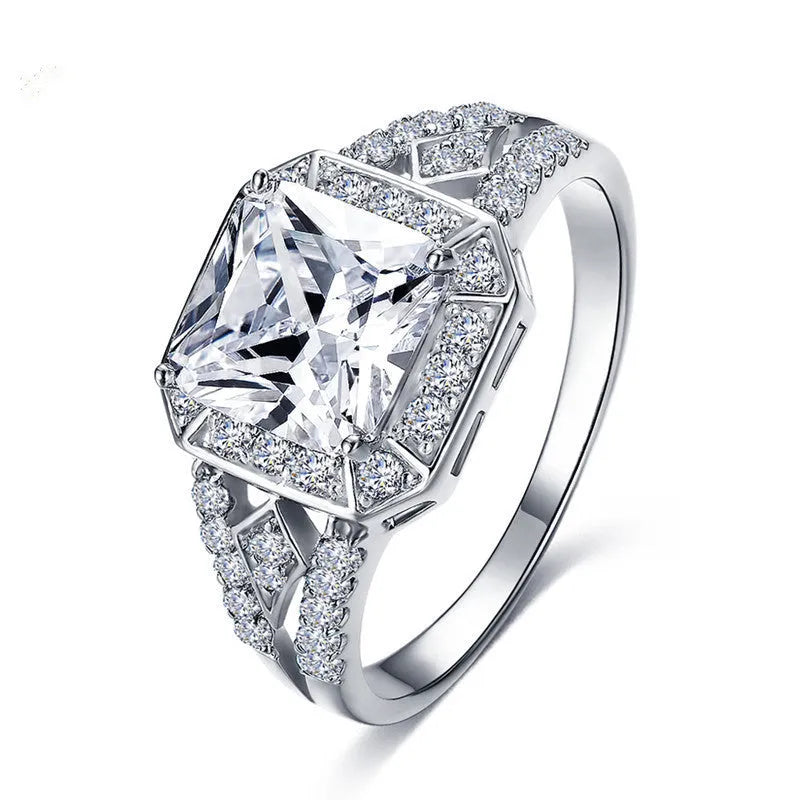 Geometric hollow zircon ring with quadrilateral design in platinum colour on copper