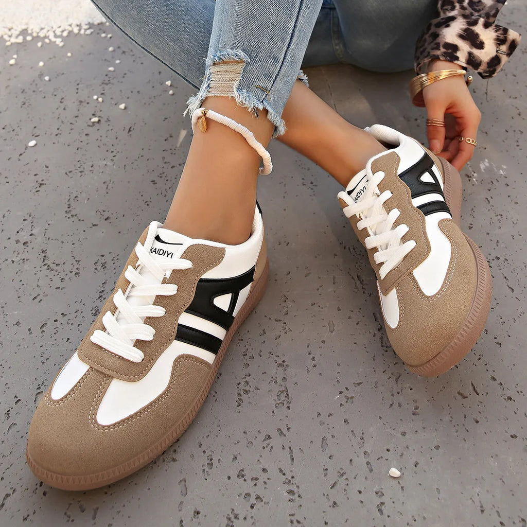 Women's retro colour matching lace-up jogging shoes with platform heel and cross-strap detailing in black, grey, and khaki options
