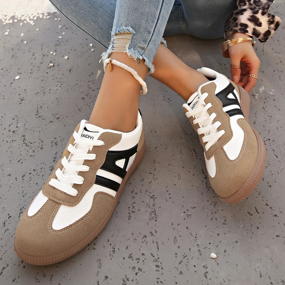 Women's retro colour matching lace-up jogging shoes with platform heel and cross-strap detailing in black, grey, and khaki options