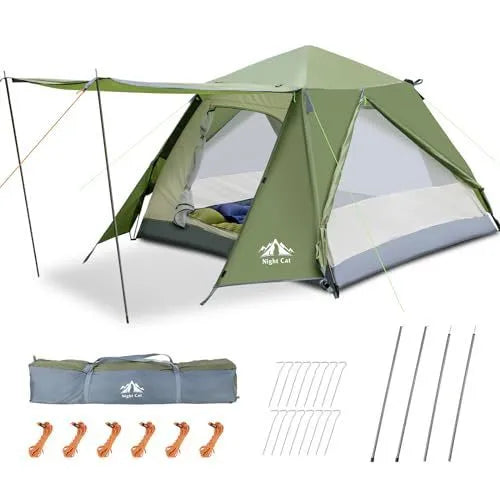 Dark green automatic pop-up tent set up in a field, showing its compact two-person size and instant design.