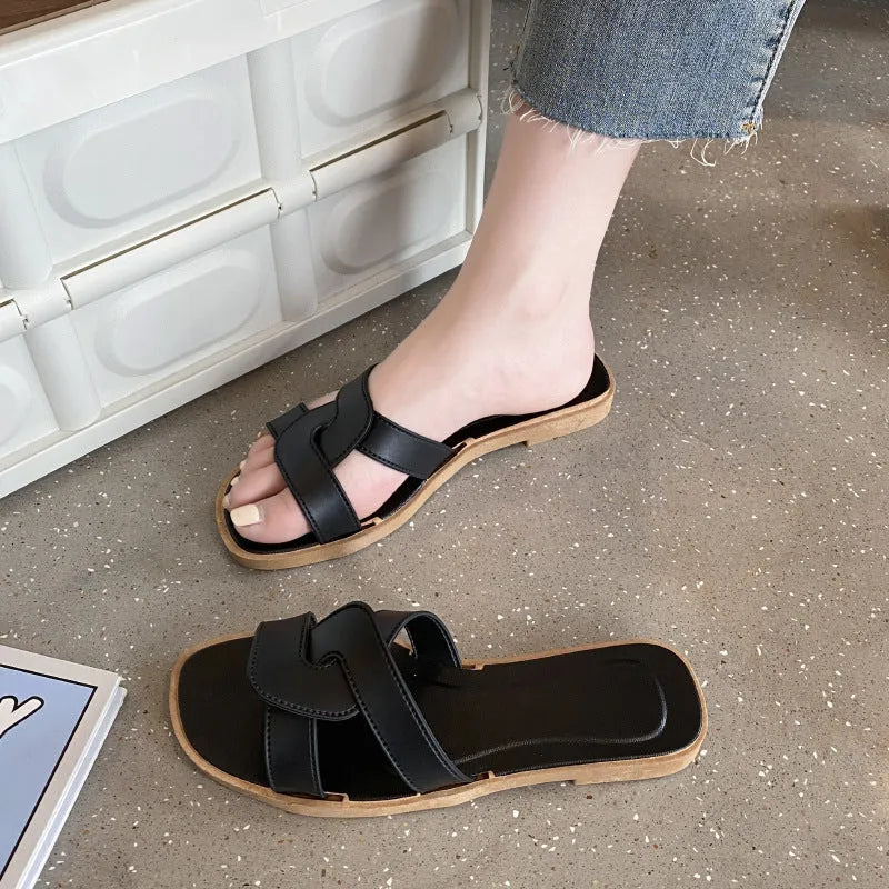 Women's PVC cross-strap flip flop sandals in light blue on a plain background.
