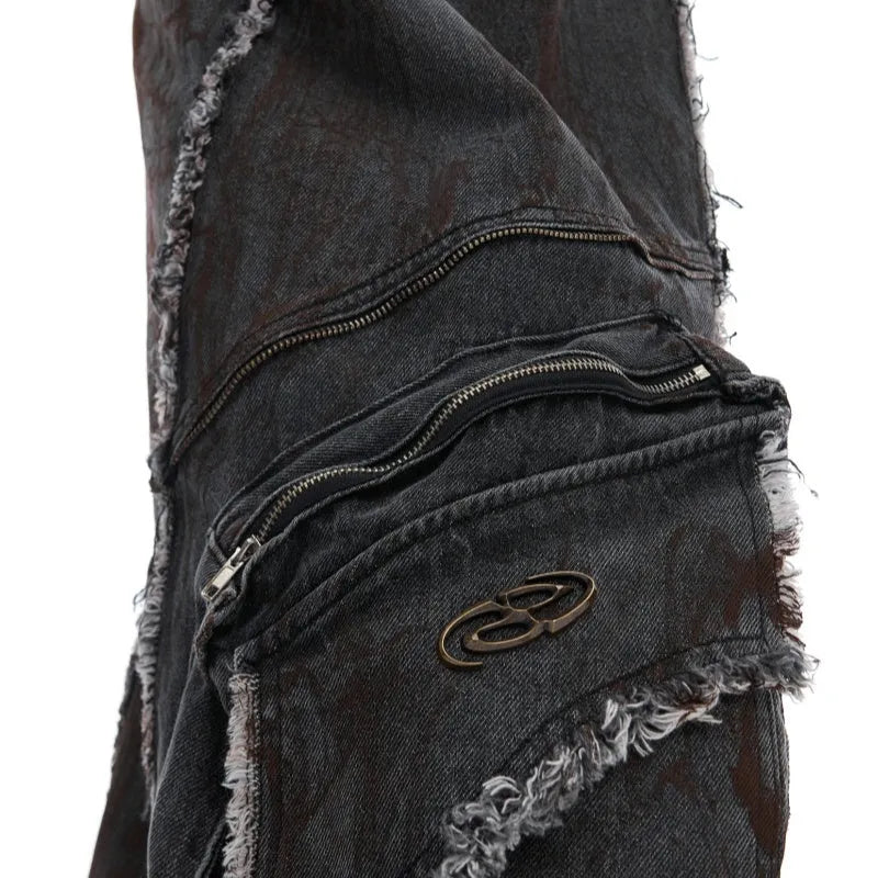 Distressed black gradient denim coat with padded shoulders and matching trousers laid flat