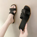 Women's PVC cross-strap flip flop sandals in light blue on a plain background.
