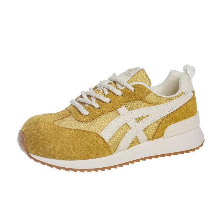 Women's white lace-up casual sneaker with round toe and flat heel on a non-slip sole.