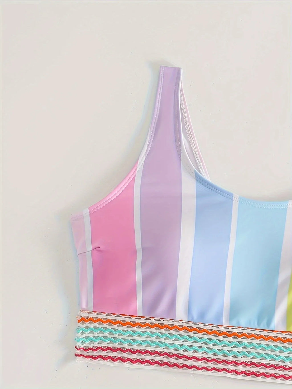 Women's striped bikini top and briefs set in a European and American style on a mannequin.