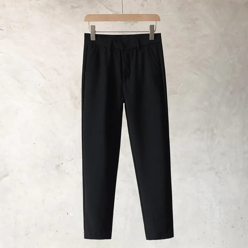 Boys slim straight wool trousers in tapered fit, shown in light grey colour.