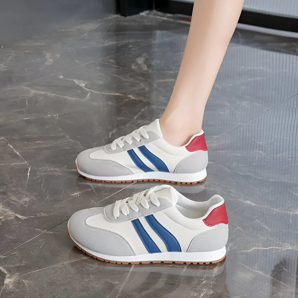 Blue and grey Cortez stripe casual sports shoes with flat heel and round toe on a wear-resistant rubber sole.