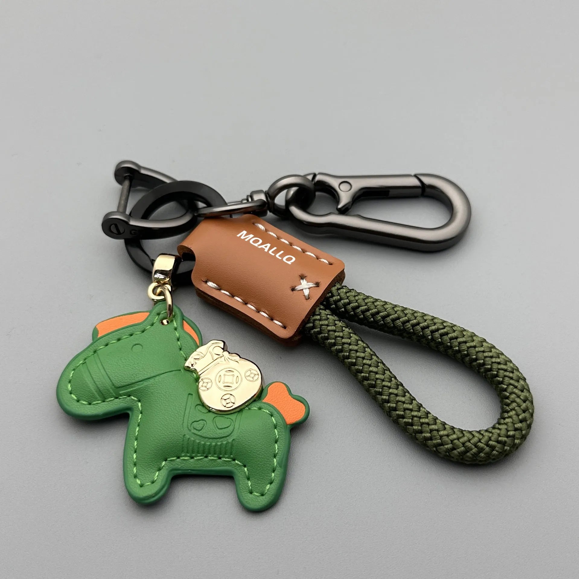 Handmade cowhide key ring pendant with a detailed zinc alloy pony buckle and coloured flannelette rope.
