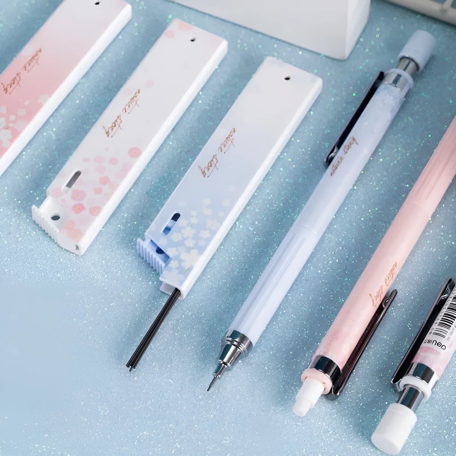 Sakura law cartoon style automatic pencil set with three coloured pencils and boxes of 0.5mm HB refills.