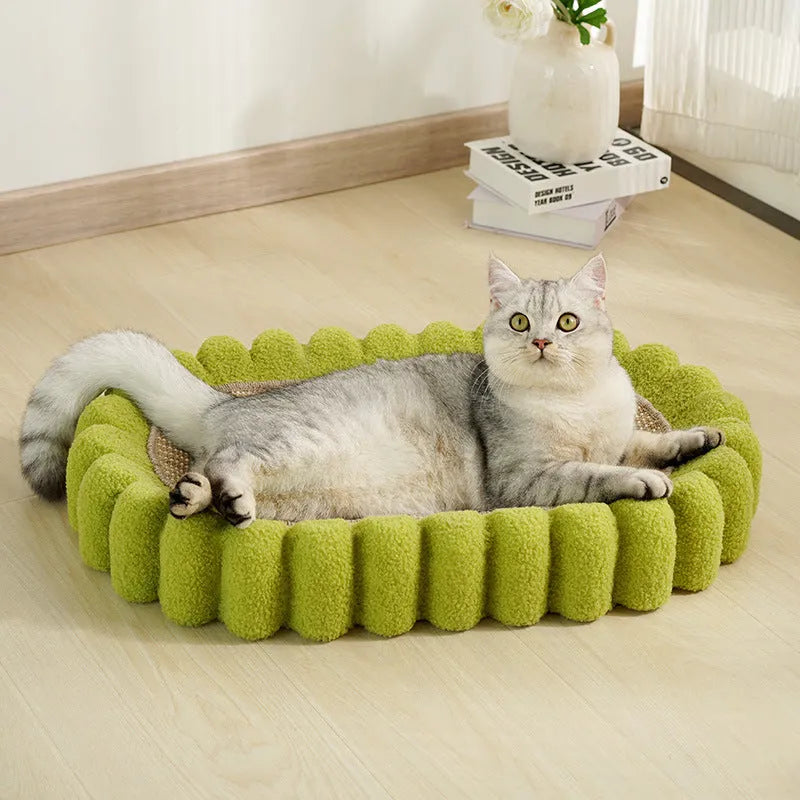 Green oval cat scratching pad and bed made from sisal fibre.