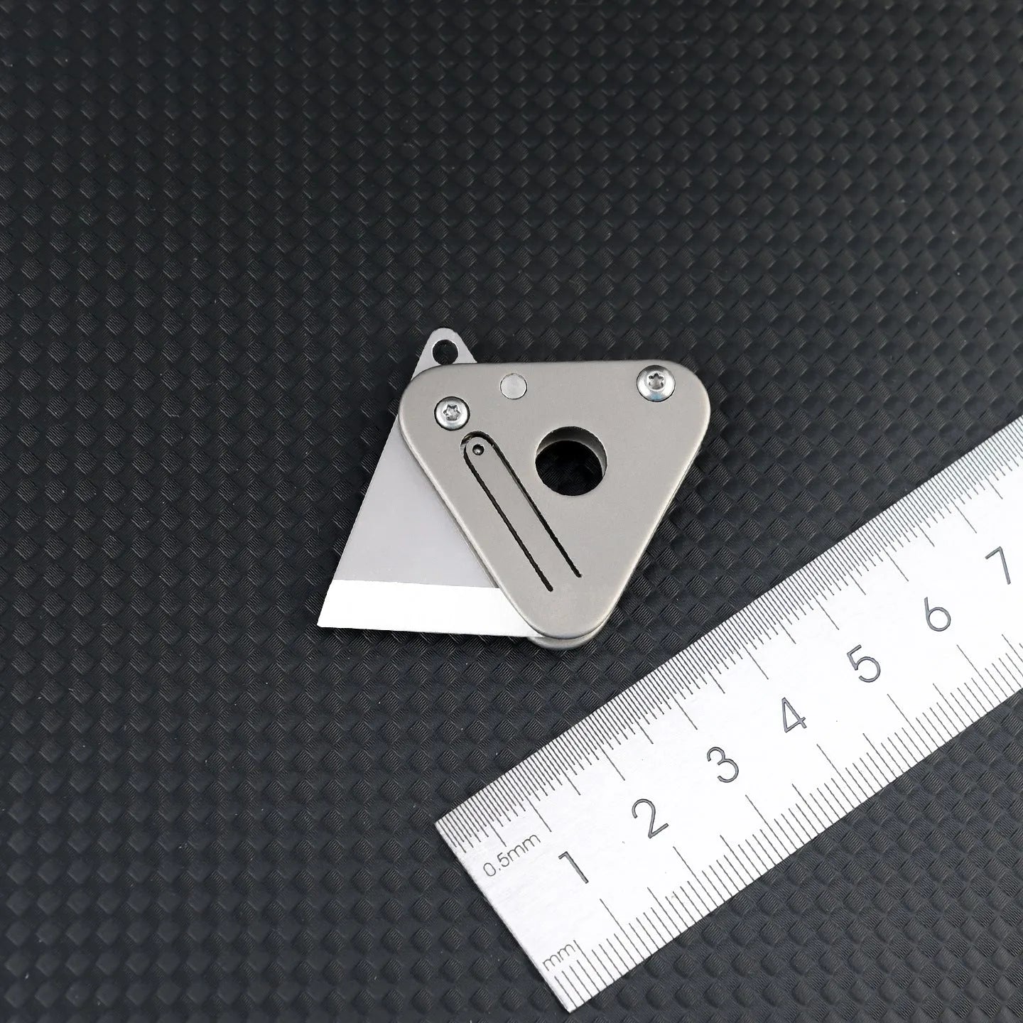 Triangle titanium alloy mini portable knife with stainless steel blade and button lock in silver gray