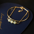 Women's Hetian jade lucky beads bracelet with gold inlay in a fake two pieces style.