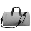Medium oval travel bag in light grey with internal wet-dry separation and multiple organisation pockets.