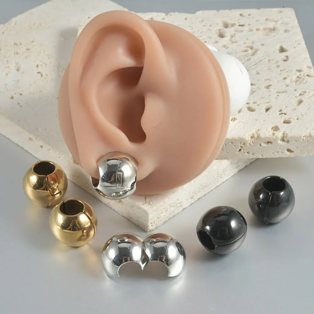 Stainless steel hollow skull and Buddha head earrings in gold, black, steel, and Buddha head colours.