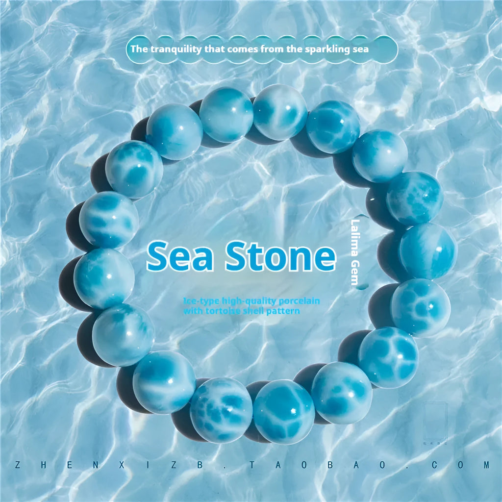 Blue natural crystal sea-pattern stone and Bodhi bracelet with pearl details on a white background.