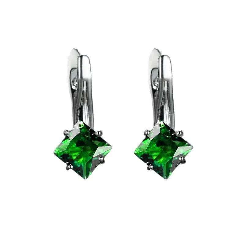 Women's copper earrings with inlaid zircon stones in a diamond design, colour option blue, on a white background