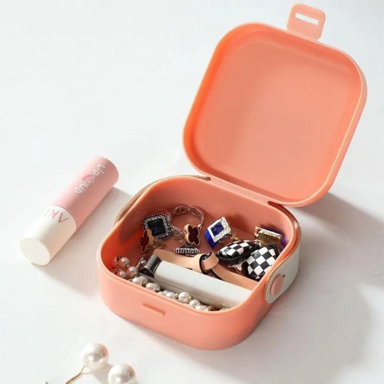 Medium solid-colour polypropylene storage box with lid for cables and headphones.