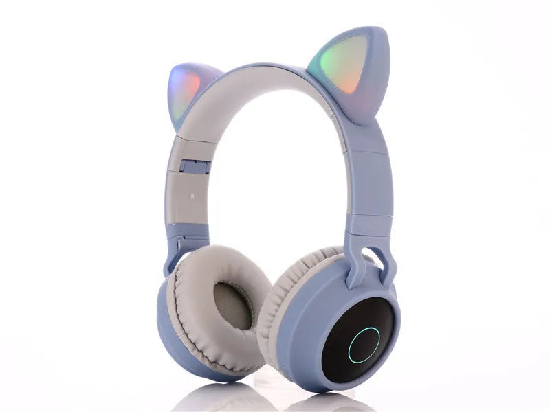 Cartoon cat ears wireless Bluetooth gaming headset shown in one of five colours: green, light blue, pink, purple, or skin tone.