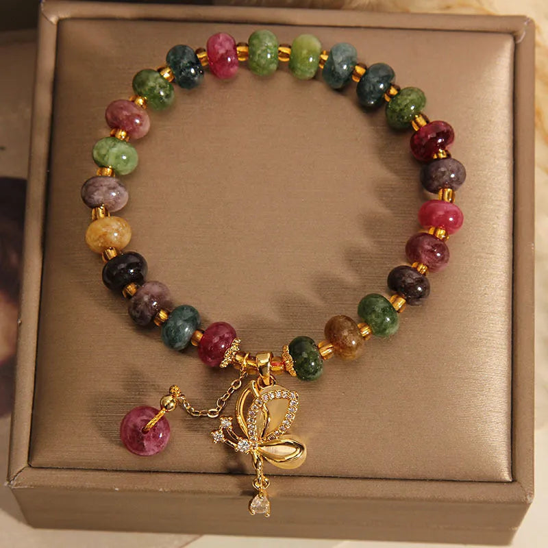 Colourful bead bracelet with alloy butterfly charm for women showing adjustable length