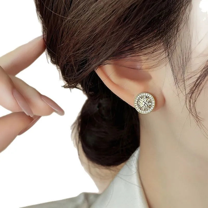 Pair of copper eight-pointed star stud earrings with real gold plating and inlaid zircon