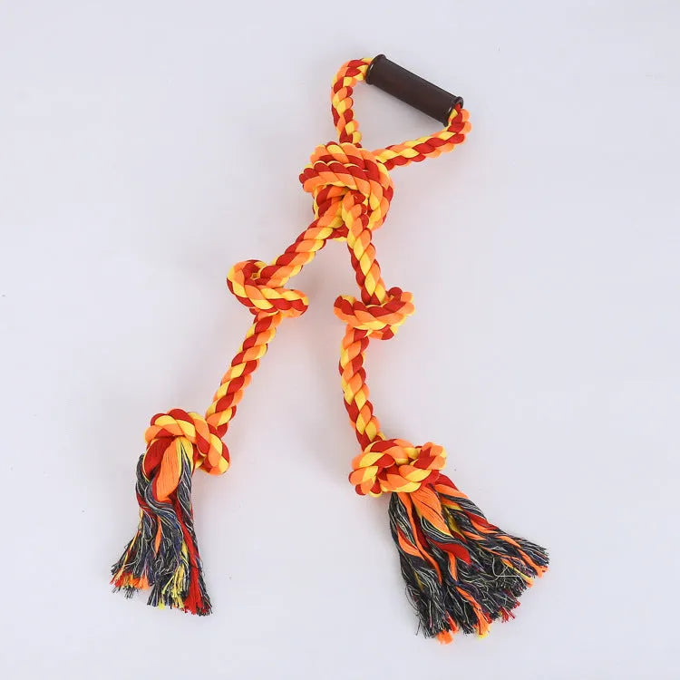Blue and yellow cotton rope dog tug toy with a handle, shown next to a large breed dog.