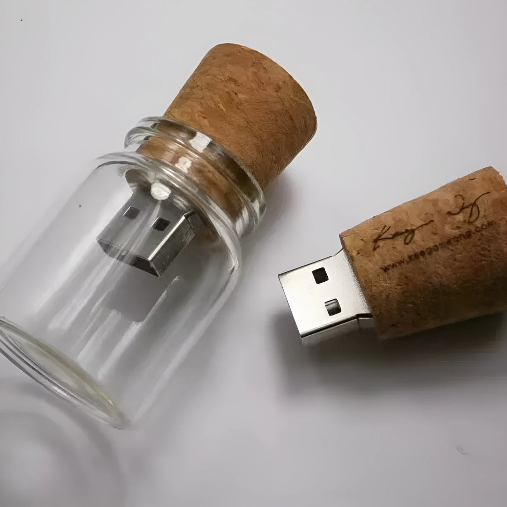 Transparent bottle-shaped USB flash drive with a wooden charm inside, showing metal connector.