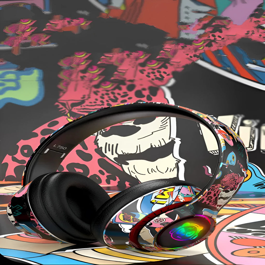 Graffiti wireless Bluetooth headset in black and white colours, shown with features like NFC and wireless charging.