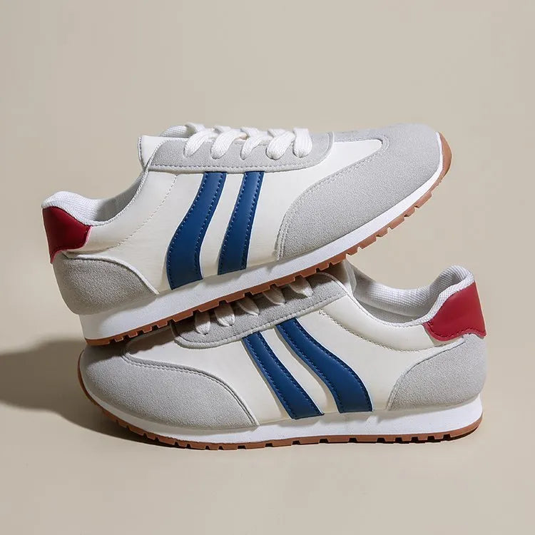 Blue and grey Cortez stripe casual sports shoes with flat heel and round toe on a wear-resistant rubber sole.