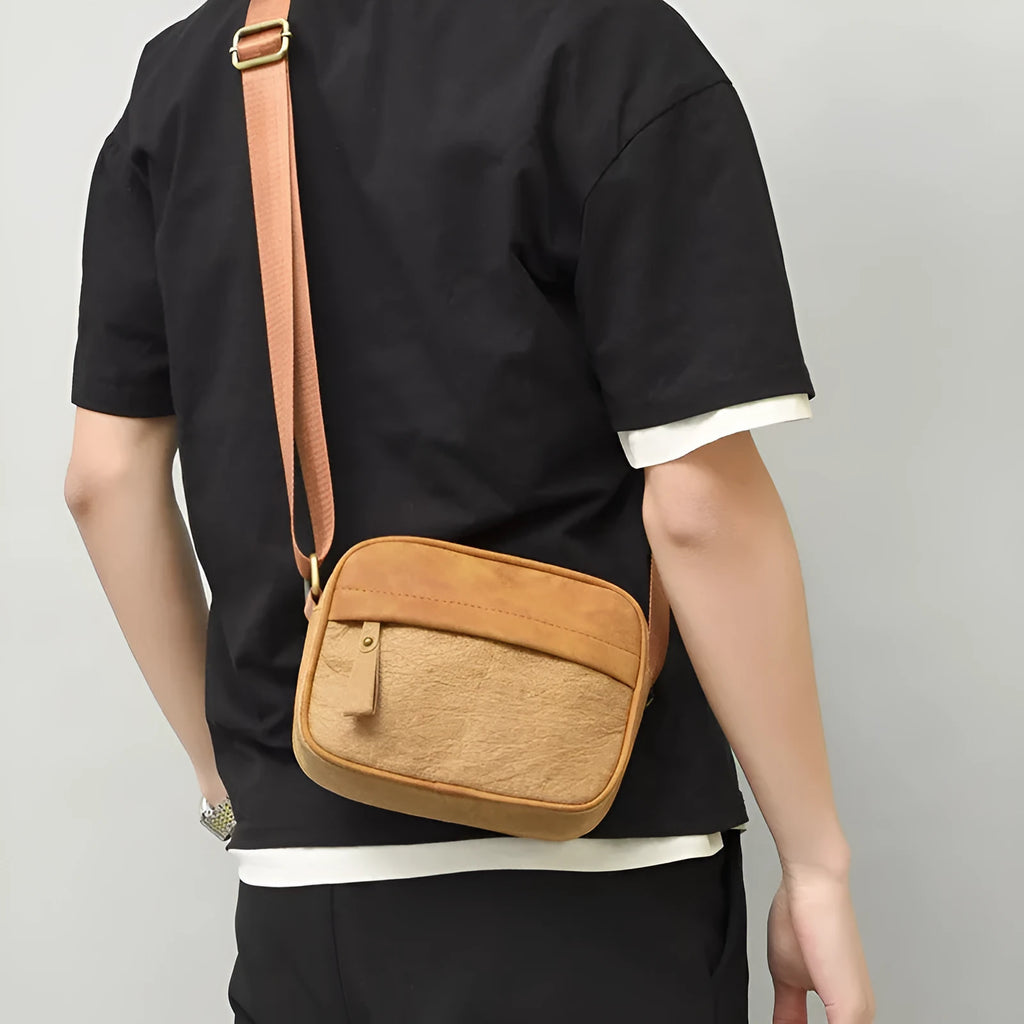 Men's waterproof paper crossbody bag in European and American retro style, shown in black, brown, and silver colour options