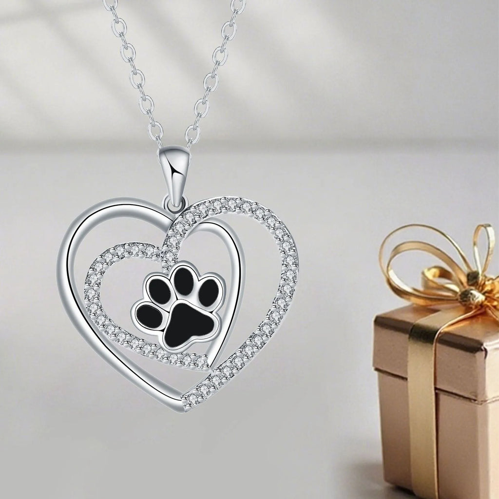 Women's copper necklace with dog paw print and heart pendant on cross chain