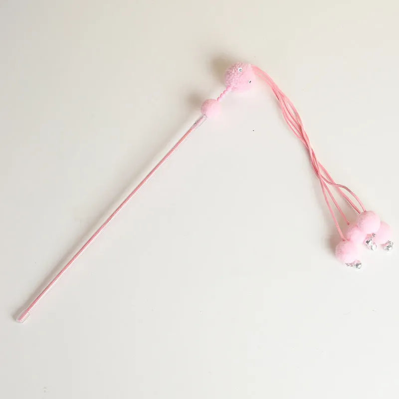 Colourful cat toy stick with a feather tassel on a foam handle in blue, pink, and purple options.