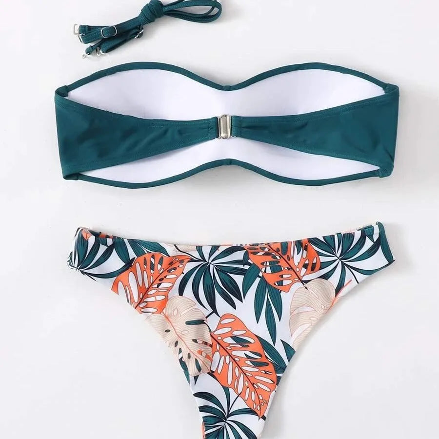 Green split push-up hard cup bikini top and coordinating briefs swimsuit laid flat.