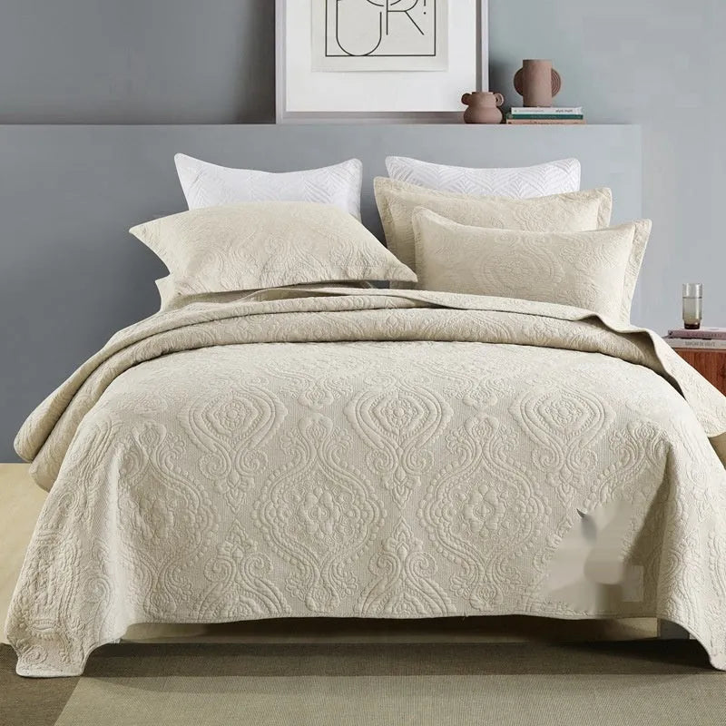 Double-sided pure cotton bed cover three-piece set in a light grey damascus pattern on a bed.