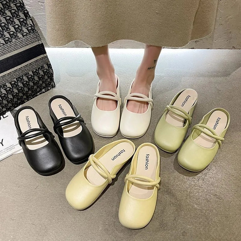 Women's black plastic toe cap flip-flop sandals on a white background.