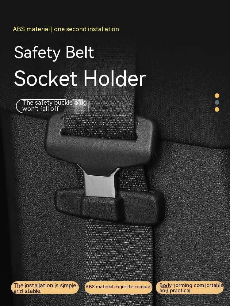 Two black ABS plastic universal car seat belt stopper clips on a white background.