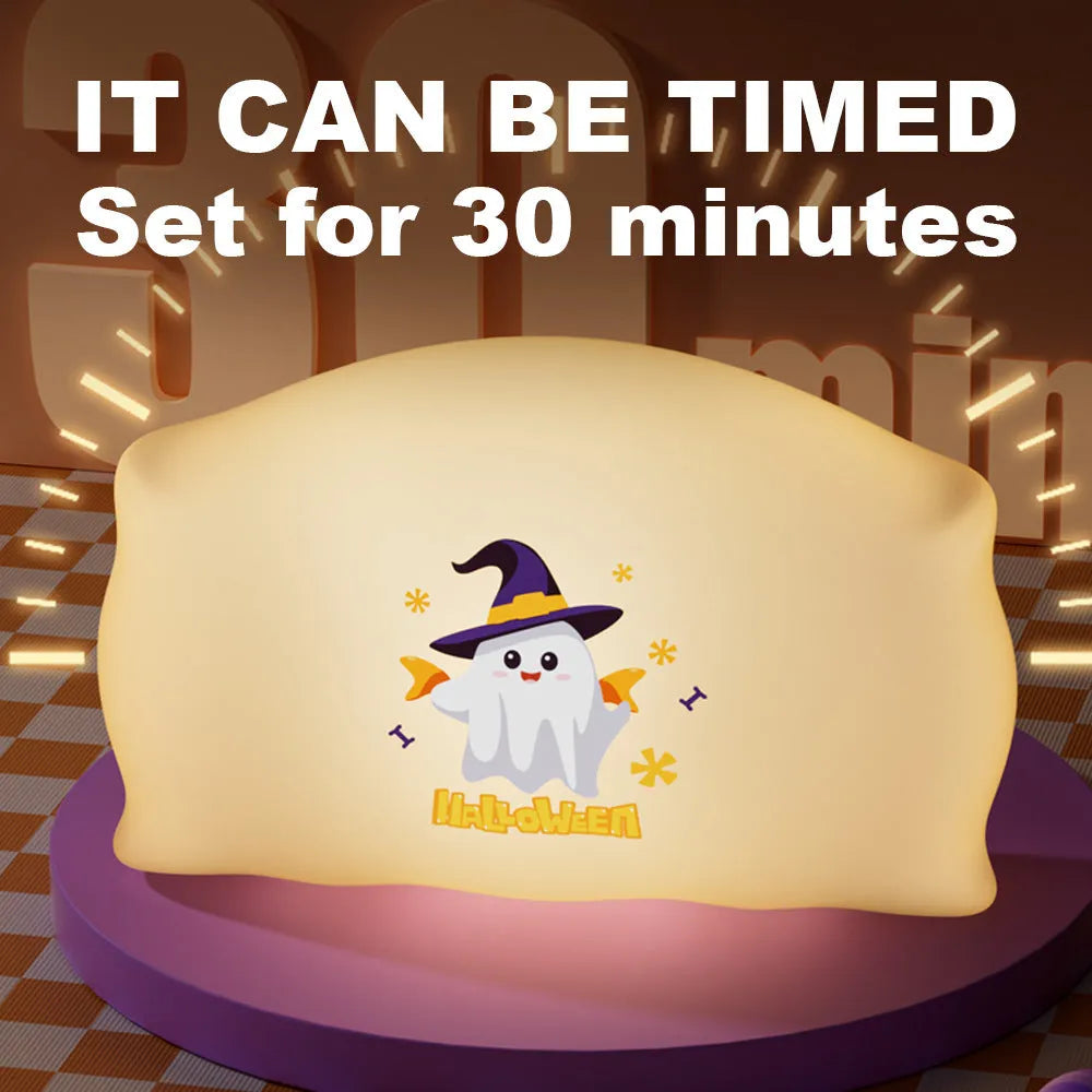 Cartoon Halloween doll table lamp in Magic Ghost colour with warm LED glow, shown on a bedside table.