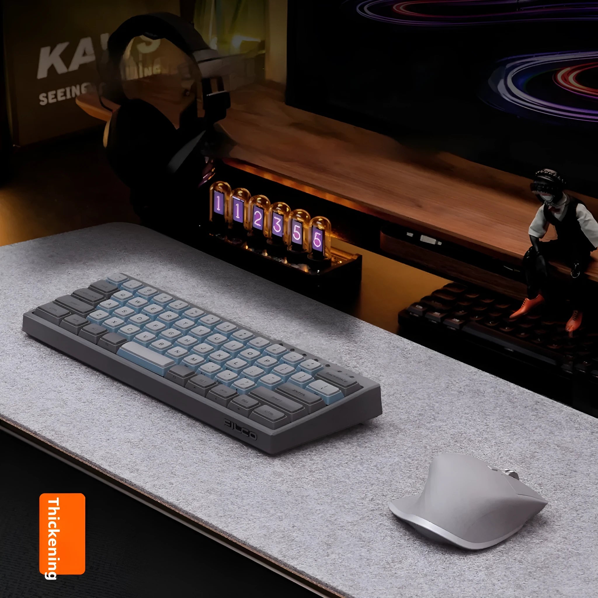 Oversized grey felt and cork office mouse mat on a wooden desk