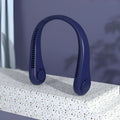 Blue portable bladeless neck fan hanging around a person's neck, showing the USB port.