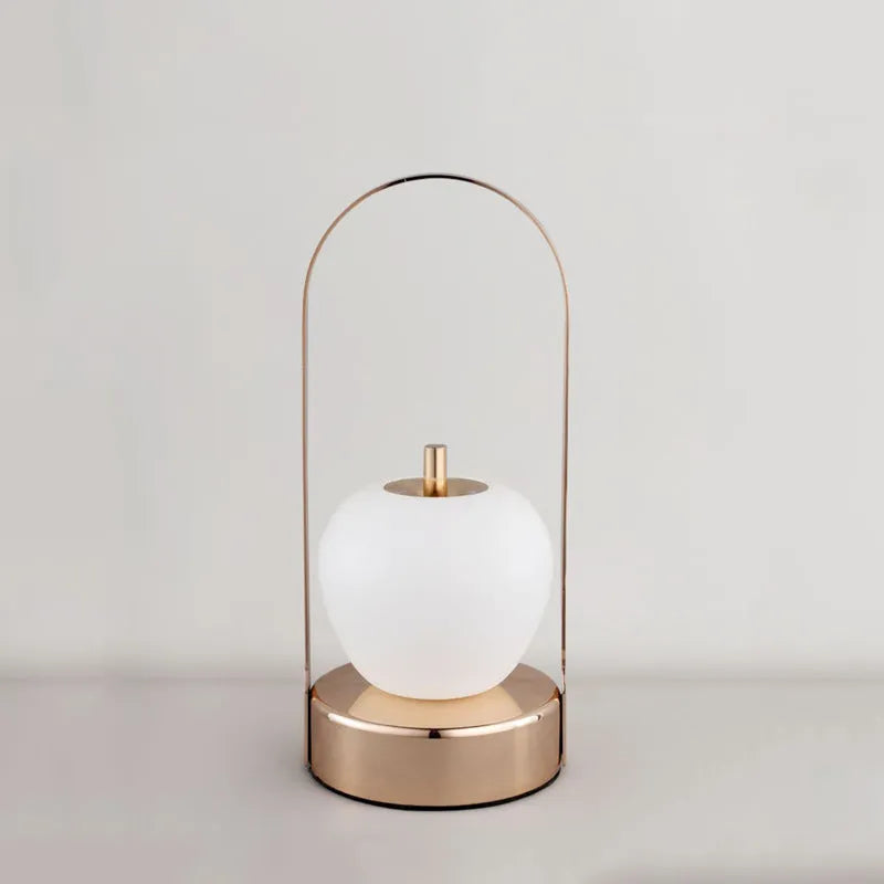 Rechargeable bedside table lamp with metal holder, golden, portable for camping and emergency use, USB charging