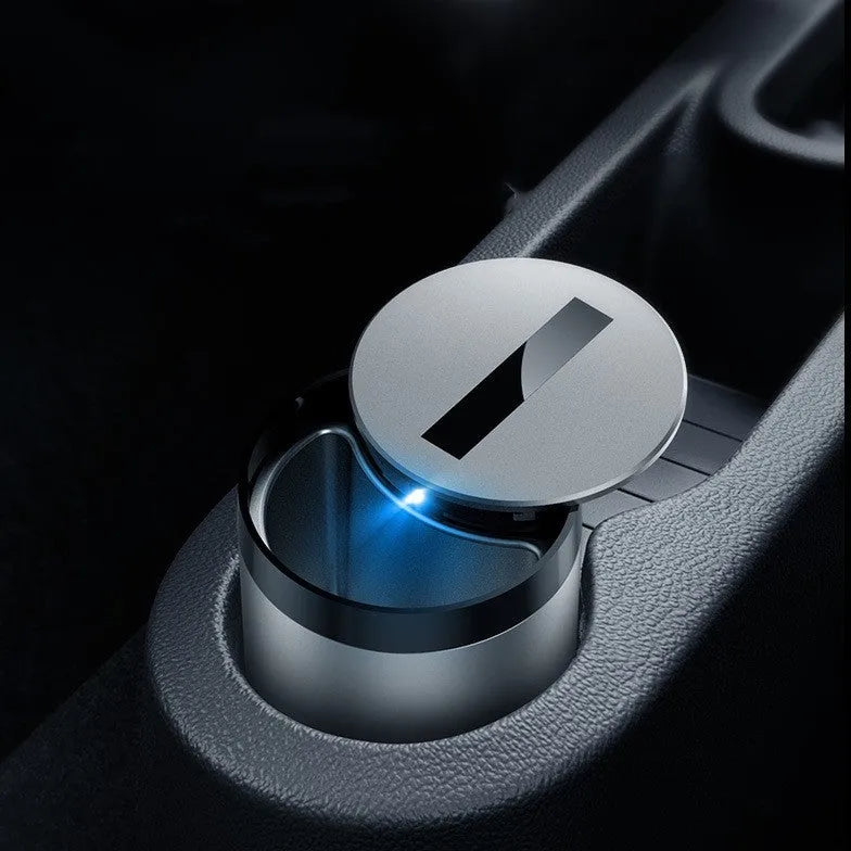 Automatic car ashtray with motion sensor in gun grey colour on car dashboard