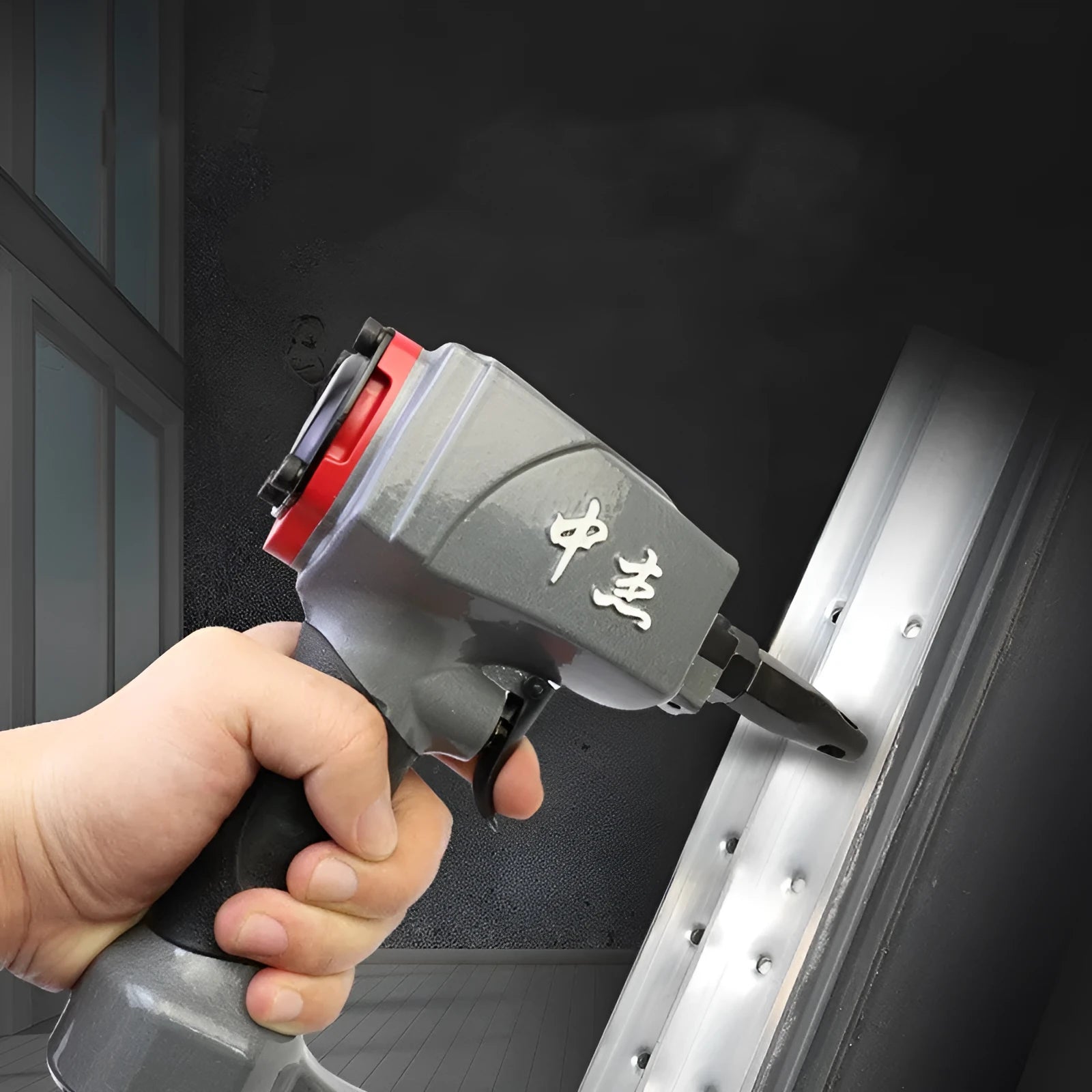 DK30 pneumatic metal sheet punching gun for industrial fabric applications.