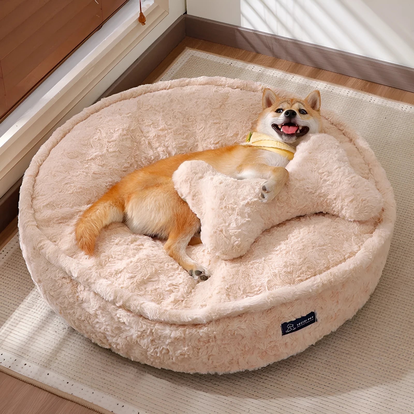 Round nest style pet bed in a milk tea colour with a removable cloth cover.
