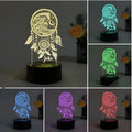 Modern acrylic dream catcher night light with remote control on a table.