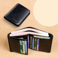 Men's black leather bifold wallet open, showing eight card slots, bill compartment, and a zip coin pocket