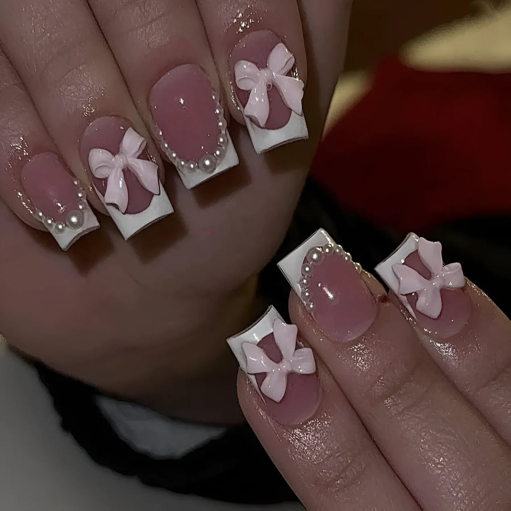 Set of 24 short, square false nails with pre-designed bow, tulip, starry sky, and leopard print patterns for a French manicure.