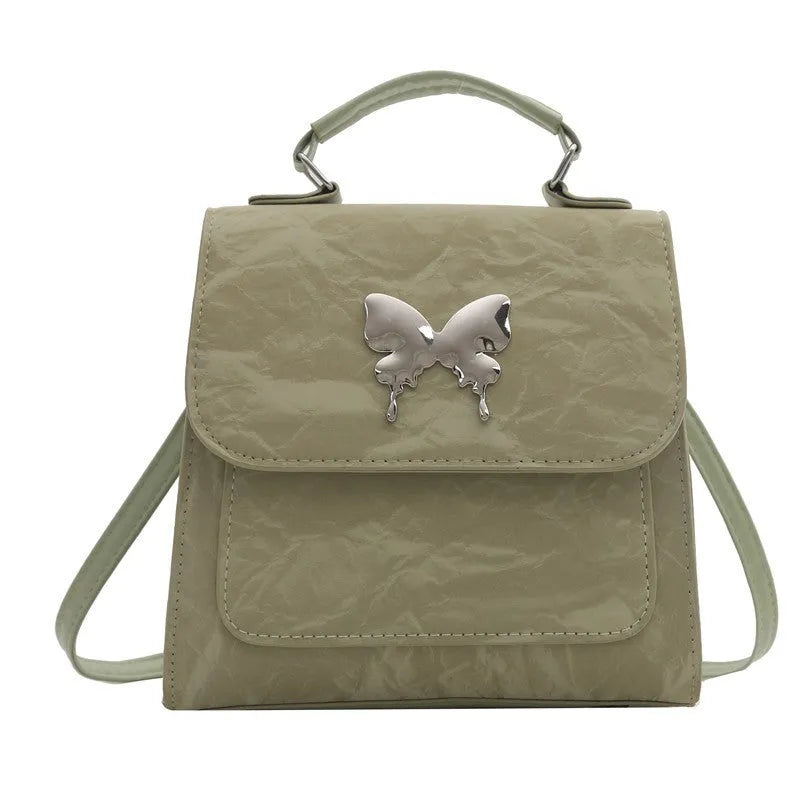 Women's preppy style PU synthetic leather backpack with bow detailing in six colour options