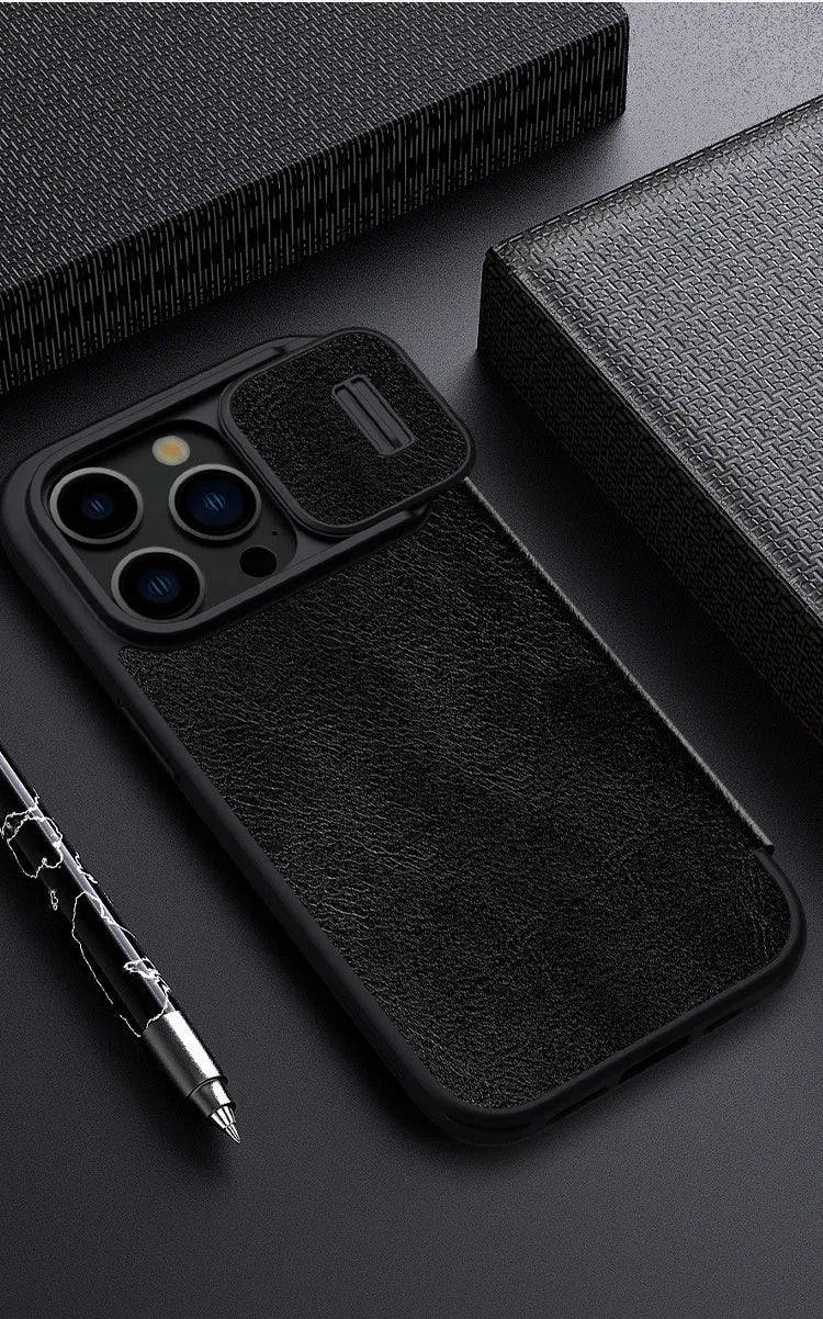 Black imitation leather flip phone case open next to an iPhone.