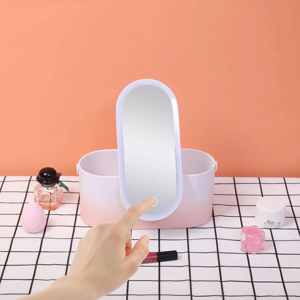 Pink portable LED makeup mirror case open, showing internal storage compartments and mirror.